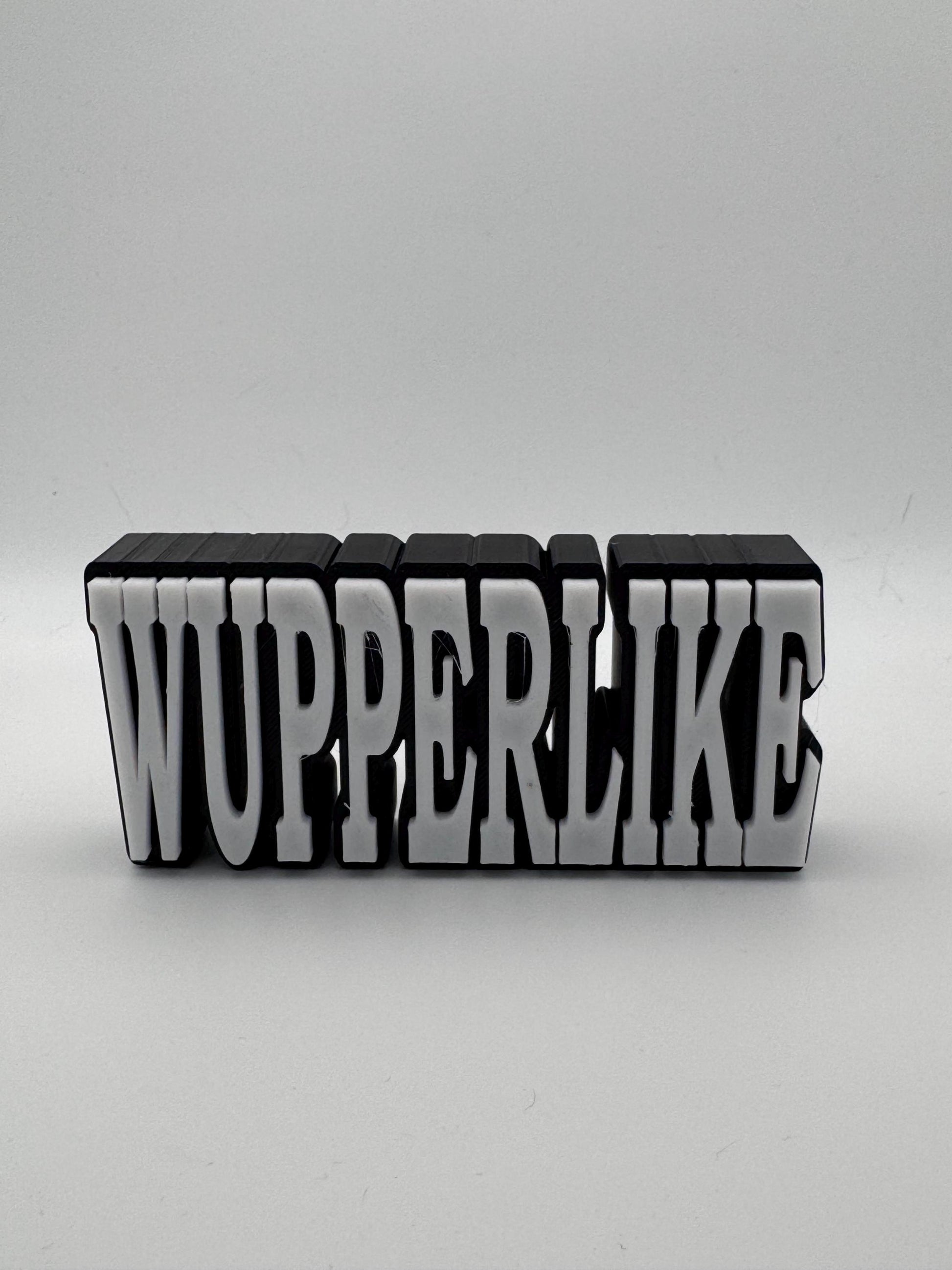 Schwarzer personalisierter 3D Schriftzug Aufsteller mit weißer Aufschrift WUPPERLIKE